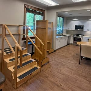 The Orchards rehabilitation center featuring faux stairs and a mock kitchen used for practicing tasks.